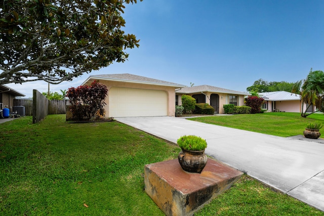 858 SE Roulette Ln, Port Saint Lucie, FL 34983 - ranch-style house featuring driveway, a garage, stucco siding, and central air condition unit