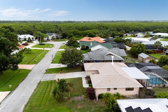858 SE Roulette Ln, Port Saint Lucie, FL 34983 - aerial perspective of suburban area featuring a heavily wooded area