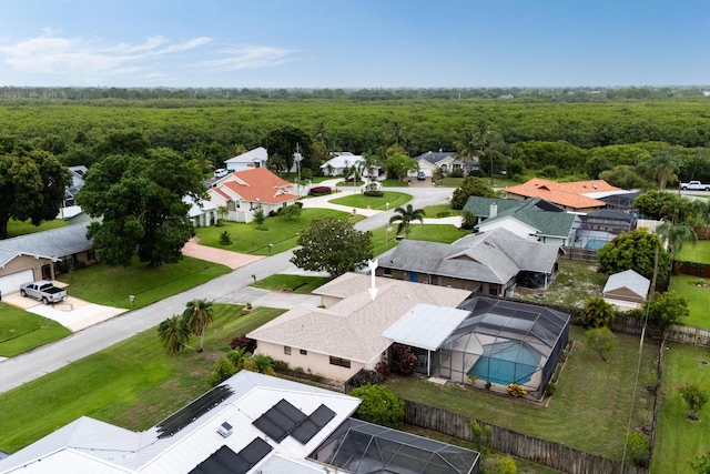858 SE Roulette Ln, Port Saint Lucie, FL 34983 - aerial perspective of suburban area with a heavily wooded area