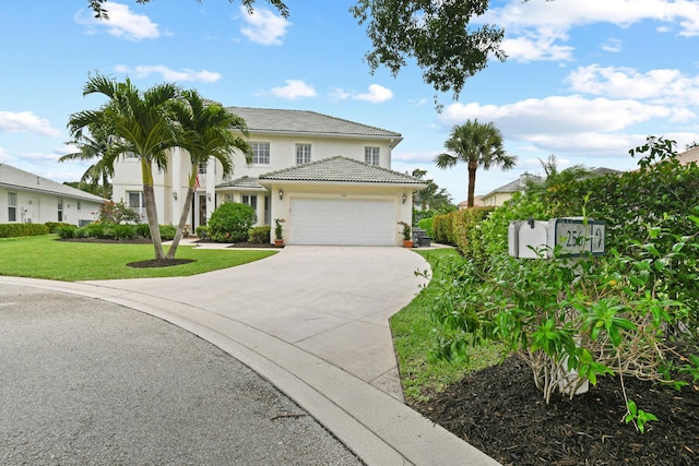 256 Coconut Pt, Jupiter, FL 33458 - view of front of house with concrete driveway, stucco siding, a front yard, a garage, and a tile roof