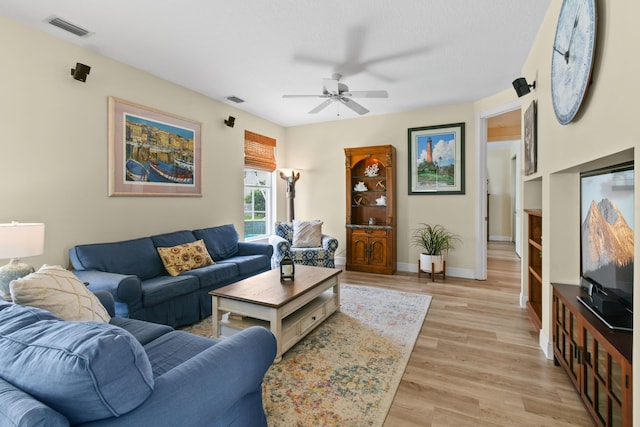 256 Coconut Pt, Jupiter, FL 33458 - living area with ceiling fan, light wood-style flooring, and baseboards