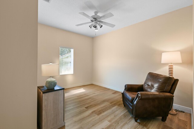 256 Coconut Pt, Jupiter, FL 33458 - sitting room featuring baseboards, light wood-type flooring, and ceiling fan