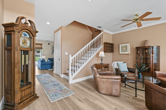 256 Coconut Pt, Jupiter, FL 33458 - living area featuring stairway, a ceiling fan, wood finished floors, baseboards, and ornamental molding