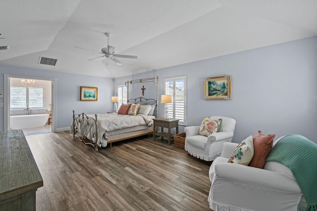 256 Coconut Pt, Jupiter, FL 33458 - bedroom featuring lofted ceiling, wood finished floors, multiple windows, a chandelier, and ceiling fan
