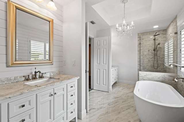 256 Coconut Pt, Jupiter, FL 33458 - bathroom with vanity, a tile shower, marble finish floors, a chandelier, and a soaking tub
