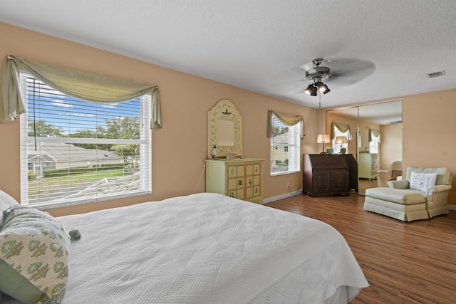 256 Coconut Pt, Jupiter, FL 33458 - bedroom featuring wood finished floors, baseboards, a ceiling fan, and a closet