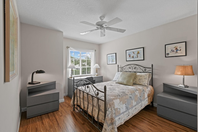 256 Coconut Pt, Jupiter, FL 33458 - bedroom with wood finished floors, a textured ceiling, ceiling fan, and baseboards