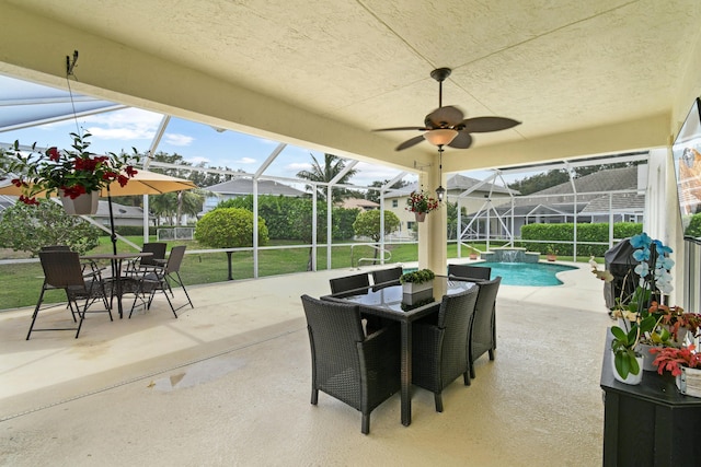 256 Coconut Pt, Jupiter, FL 33458 - view of patio featuring a lanai, outdoor dining space, an outdoor pool, and ceiling fan