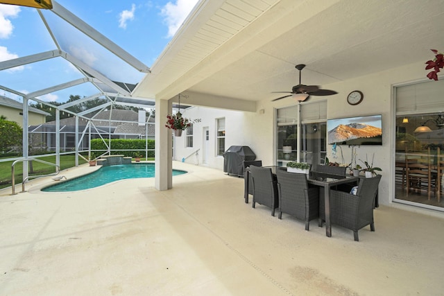 256 Coconut Pt, Jupiter, FL 33458 - outdoor pool with area for grilling, a patio area, a ceiling fan, a lanai, and outdoor dining area