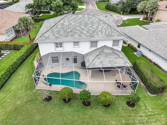 256 Coconut Pt, Jupiter, FL 33458 - back of property featuring stucco siding, a patio area, an outdoor pool, and a lanai