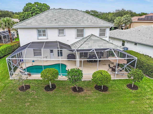 256 Coconut Pt, Jupiter, FL 33458 - back of property featuring a patio, a tiled roof, a lanai, and a yard