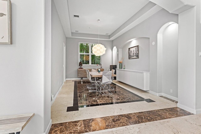 16370 Via Fontana, Delray Beach, FL 33484 - dining room with inlaid floor details, arched walkways, baseboards, and marble tiled flooring