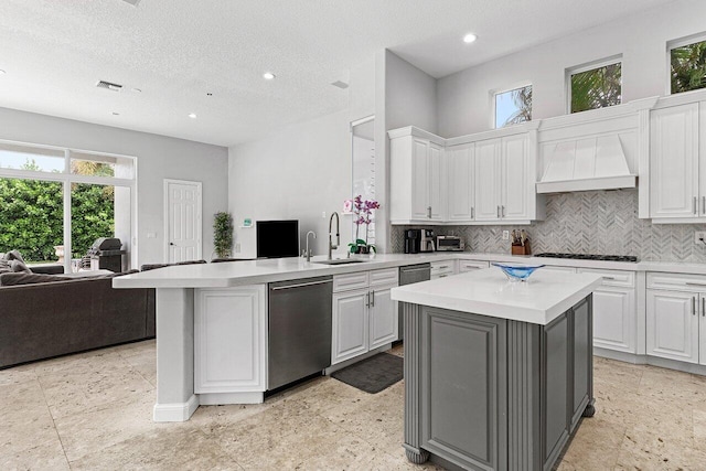 16370 Via Fontana, Delray Beach, FL 33484 - kitchen featuring open floor plan, a sink, wall chimney range hood, dishwasher, and black gas stovetop