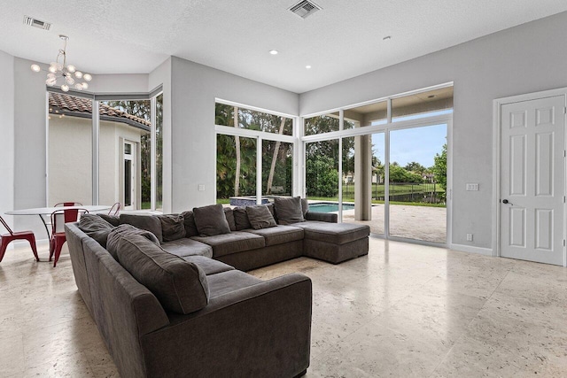 16370 Via Fontana, Delray Beach, FL 33484 - living area with a chandelier, recessed lighting, a textured ceiling, and baseboards