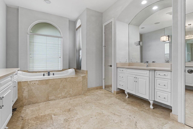 16370 Via Fontana, Delray Beach, FL 33484 - bathroom featuring vanity, a bath, and stone finish flooring