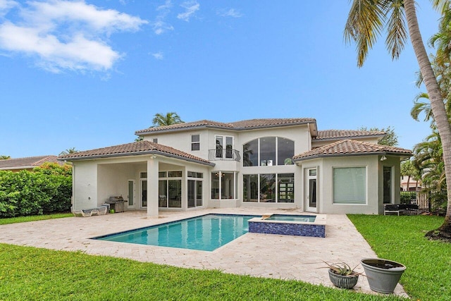 16370 Via Fontana, Delray Beach, FL 33484 - back of house with stucco siding, a patio area, and a yard