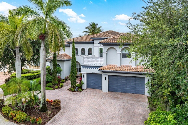 16370 Via Fontana, Delray Beach, FL 33484 - mediterranean / spanish-style home with a tiled roof, an attached garage, decorative driveway, stucco siding, and a balcony