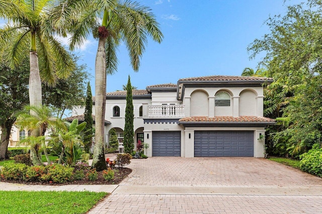 16370 Via Fontana, Delray Beach, FL 33484 - mediterranean / spanish-style home featuring a balcony, a garage, decorative driveway, and stucco siding