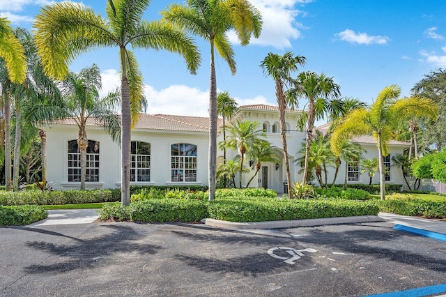 16370 Via Fontana, Delray Beach, FL 33484 - view of front of house with stucco siding, a tile roof, and uncovered parking