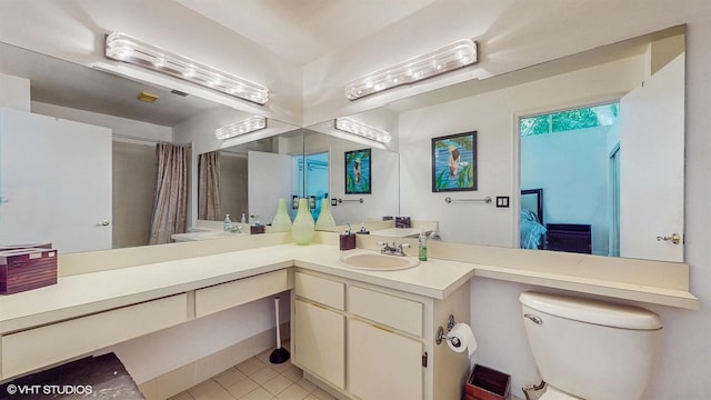 8912 Thumbwood Cir Unit C, Boynton Beach, FL 33436 - full bathroom featuring toilet, tile patterned flooring, double vanity, and a shower with curtain