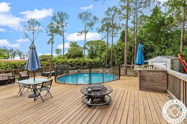 4038 Calamondin Blvd, The Acreage, FL 33470 - view of pool with a fire pit and a wooden deck