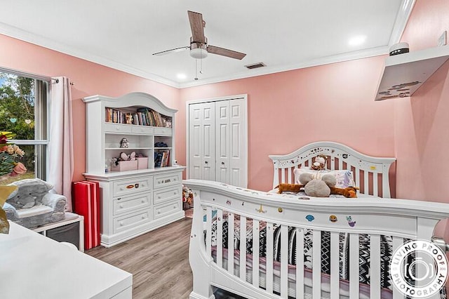 4038 Calamondin Blvd, The Acreage, FL 33470 - bedroom featuring a closet, light wood-style floors, crown molding, and a ceiling fan