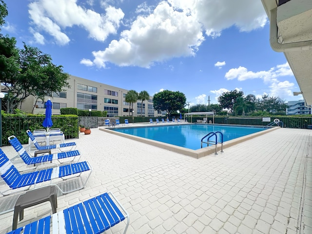 3154 Via Poinciana Unit 409, Lake Worth, FL 33467 - community pool with a patio area