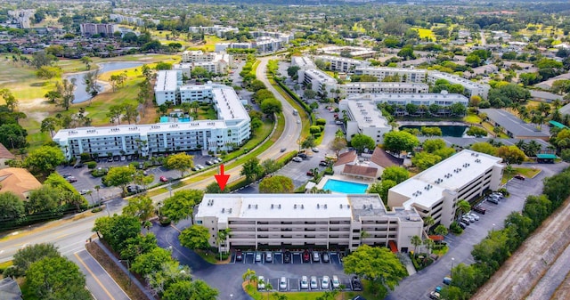 3154 Via Poinciana Unit 409, Lake Worth, FL 33467 - aerial view of apartment complex, a pool, and a large body of water