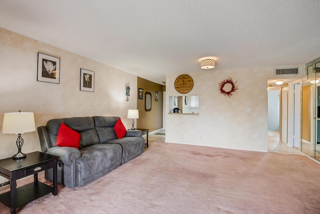 3154 Via Poinciana Unit 409, Lake Worth, FL 33467 - living area featuring carpet flooring, a textured ceiling, and baseboards