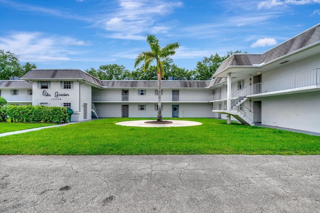 10249 N Military Trl Unit 206, Palm Beach Gardens, FL 33410 - view of building exterior with stairway