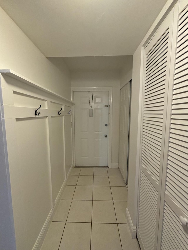 2895 SW 22nd Ave Unit 2060, Delray Beach, FL 33445 - hall featuring light tile patterned flooring and baseboards