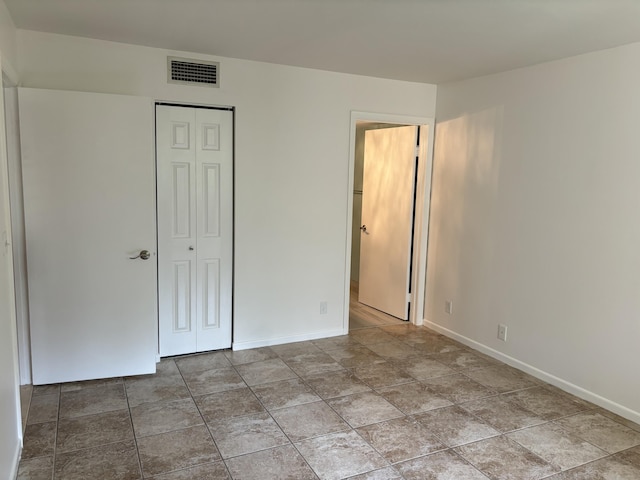 2895 SW 22nd Ave Unit 2060, Delray Beach, FL 33445 - unfurnished bedroom with baseboards and a closet