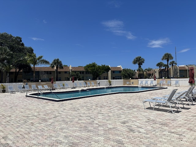 2895 SW 22nd Ave Unit 2060, Delray Beach, FL 33445 - community pool featuring a residential view and a patio