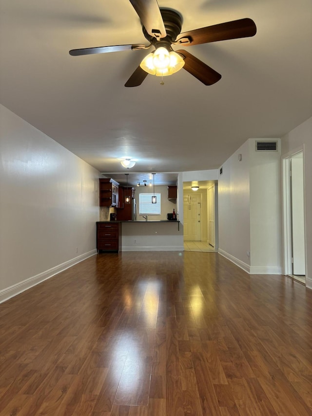2895 SW 22nd Ave Unit 2060, Delray Beach, FL 33445 - unfurnished living room featuring dark wood-style floors and ceiling fan