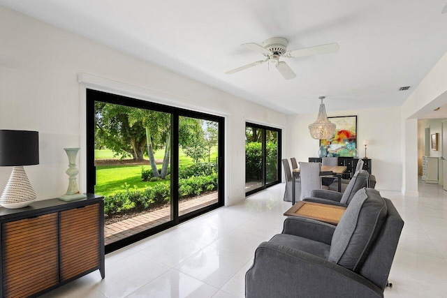 4483 Meadowlark Ln, Boynton Beach, FL 33436 - living area with light tile patterned flooring and a ceiling fan