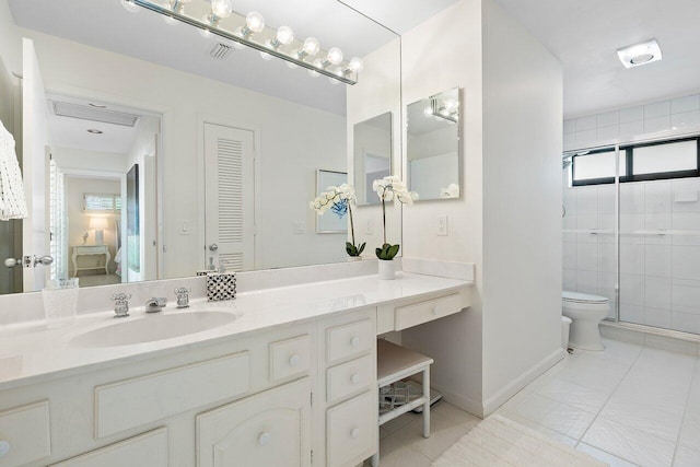 4483 Meadowlark Ln, Boynton Beach, FL 33436 - bathroom featuring vanity, toilet, a stall shower, and tile patterned floors