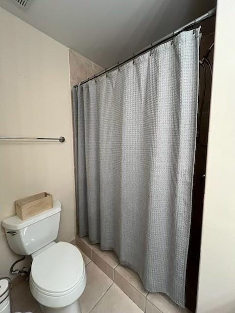 3153 Clint Moore Rd Unit 204, Boca Raton, FL 33496 - bathroom with toilet, tile patterned flooring, and a shower with curtain