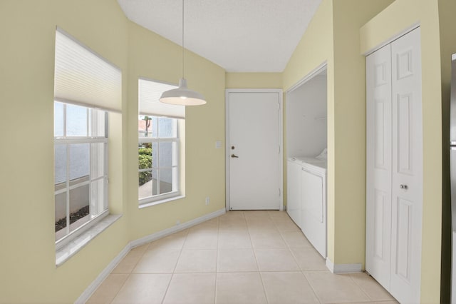6095 Floral Lakes Dr, Delray Beach, FL 33484 - laundry room with separate washer and dryer, baseboards, and light tile patterned floors