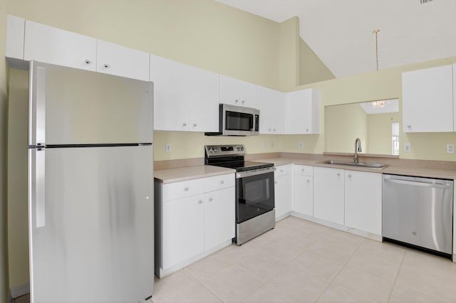 6095 Floral Lakes Dr, Delray Beach, FL 33484 - kitchen featuring stainless steel appliances, a sink, high vaulted ceiling, light countertops, and white cabinets