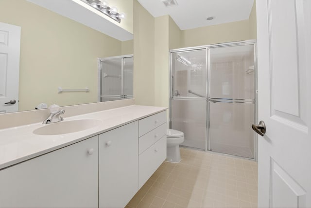 6095 Floral Lakes Dr, Delray Beach, FL 33484 - full bathroom with toilet, vanity, a shower stall, and tile patterned floors
