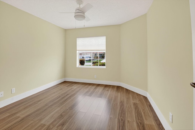 6095 Floral Lakes Dr, Delray Beach, FL 33484 - empty room featuring wood finished floors, ceiling fan, baseboards, and a textured ceiling