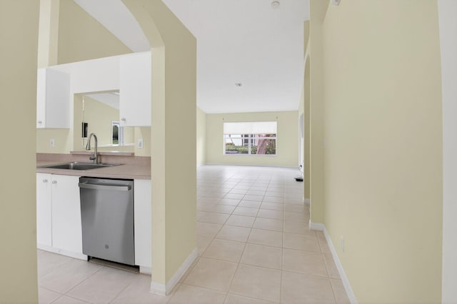 6095 Floral Lakes Dr, Delray Beach, FL 33484 - kitchen with dishwasher, a sink, light tile patterned floors, and white cabinetry