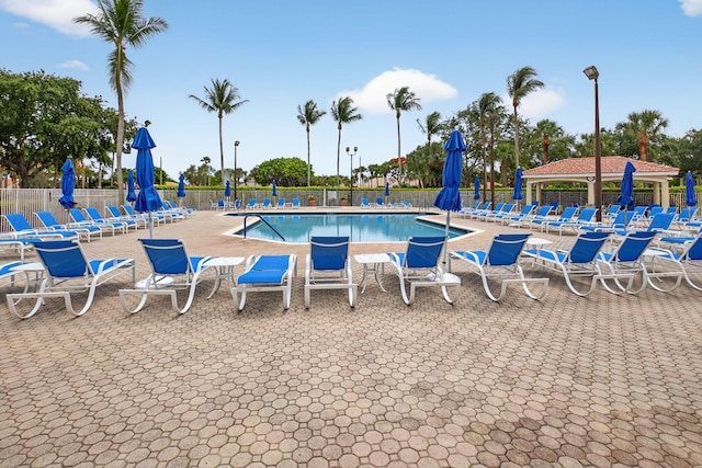 6095 Floral Lakes Dr, Delray Beach, FL 33484 - community pool featuring a patio