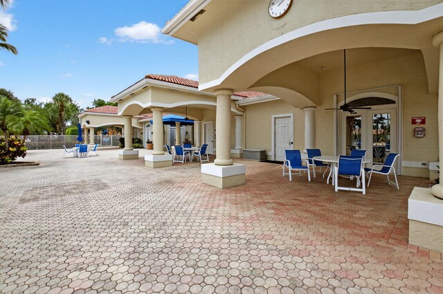 6095 Floral Lakes Dr, Delray Beach, FL 33484 - view of patio with outdoor dining area and ceiling fan
