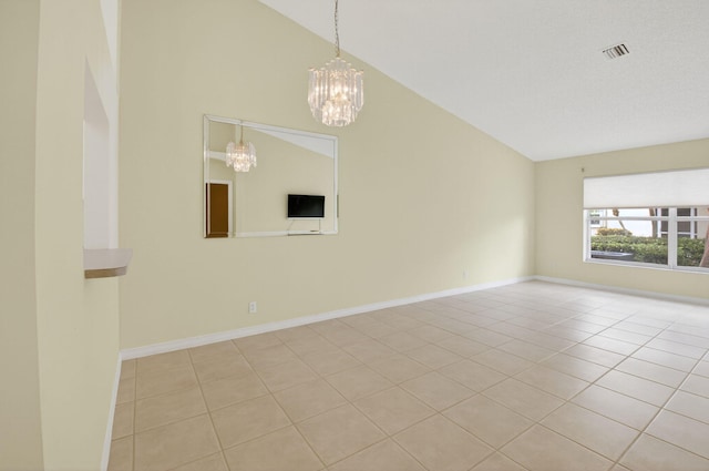 6095 Floral Lakes Dr, Delray Beach, FL 33484 - empty room featuring vaulted ceiling, a chandelier, light tile patterned floors, and baseboards