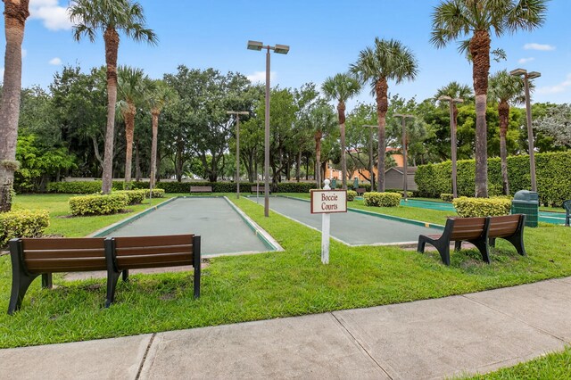 6095 Floral Lakes Dr, Delray Beach, FL 33484 - view of property's community featuring a game area, a lawn, and view of wooded area