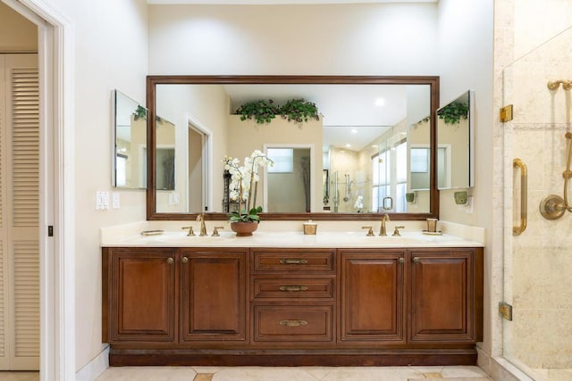 256 Eagleton Estates Blvd, Palm Beach Gardens, FL 33418 - bathroom featuring a closet, a shower stall, double vanity, and tile patterned flooring
