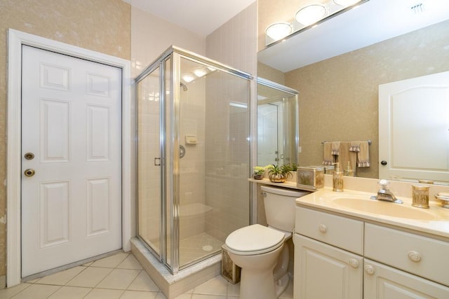256 Eagleton Estates Blvd, Palm Beach Gardens, FL 33418 - full bathroom with tile patterned flooring, vanity, a shower stall, and toilet
