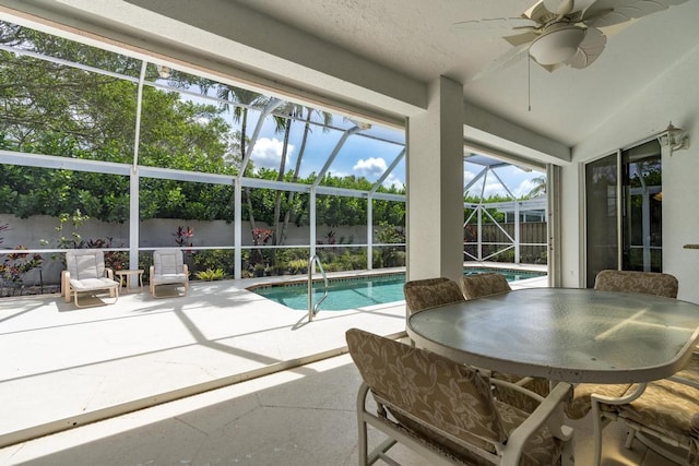 256 Eagleton Estates Blvd, Palm Beach Gardens, FL 33418 - view of swimming pool with a fenced backyard, a patio, a ceiling fan, glass enclosure, and outdoor dining area