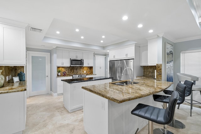 1948 Coco Palm Pl, Lauderdale By The Sea, FL 33062 - kitchen featuring stainless steel appliances, a peninsula, tasteful backsplash, recessed lighting, and white cabinets